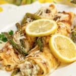 two chicken crepes with lemon on top