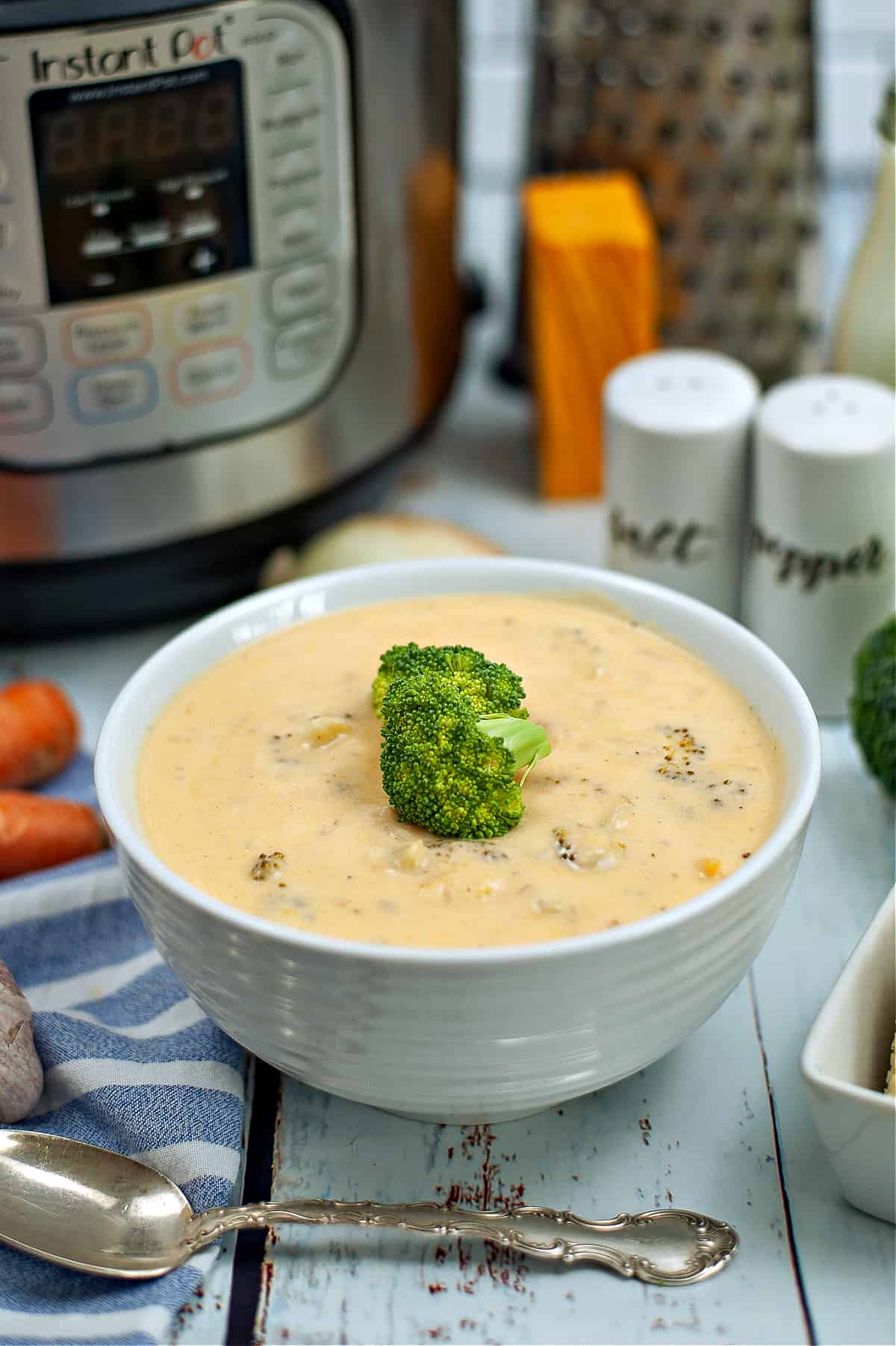 instant pot and bowl of broccoli cheddar soup