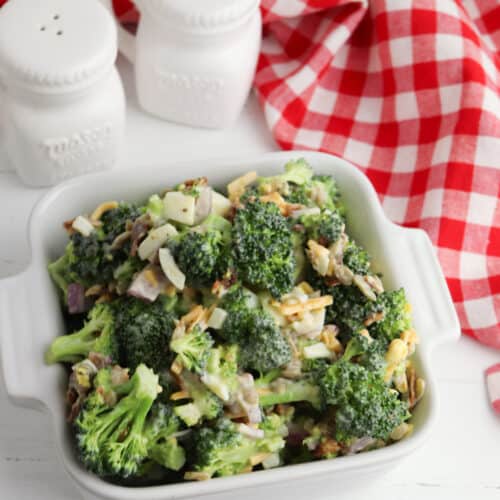 bowl of broccoli salad with red check napkin