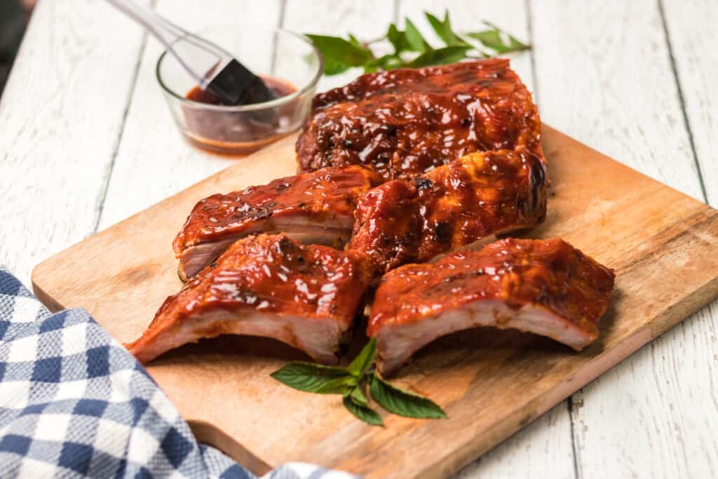 bbq ribs on a wood cutting board