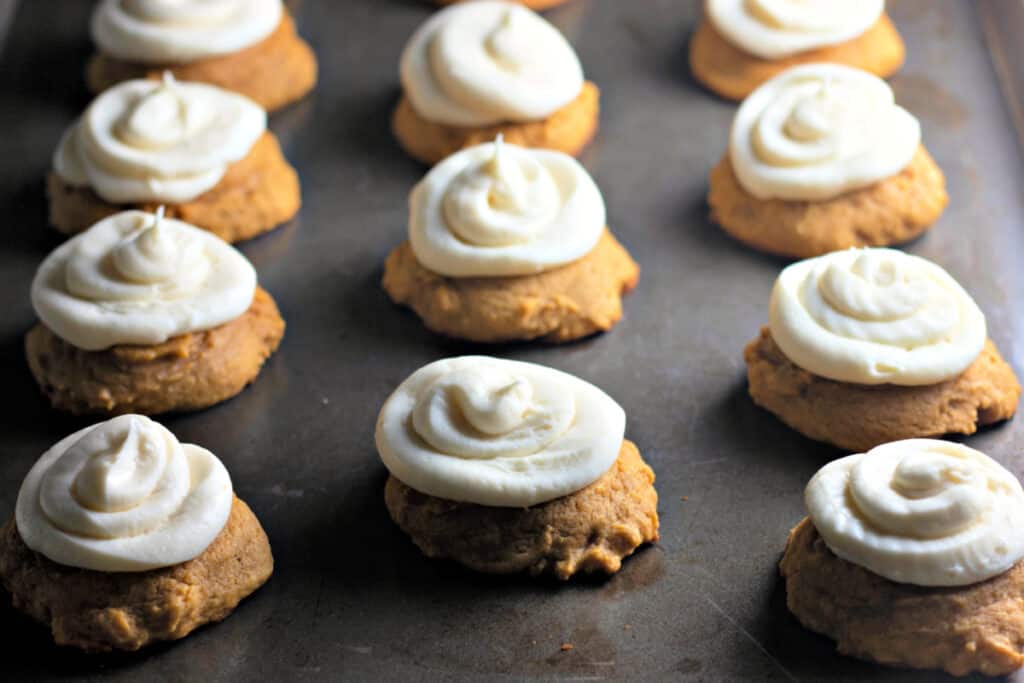 iced pumpkin cookies in baking pan