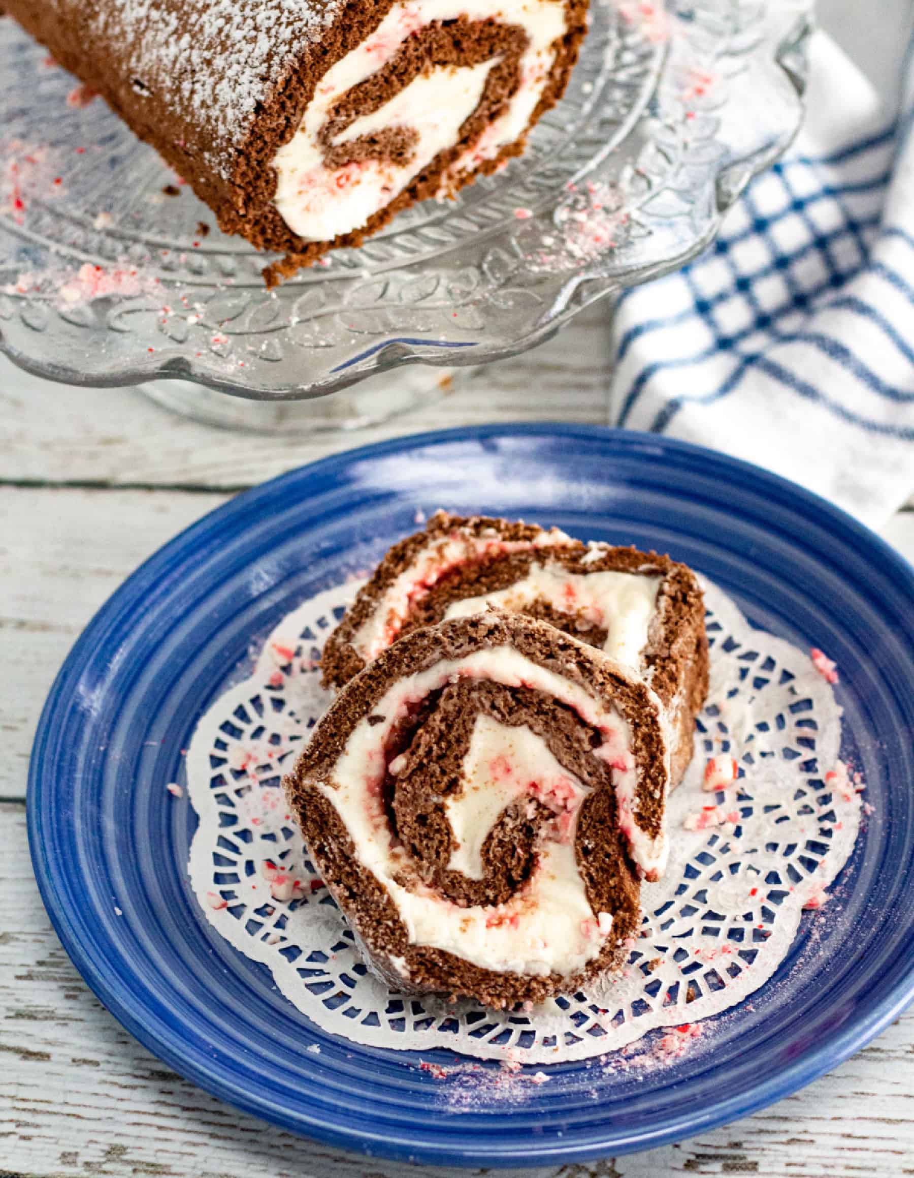 slices and roll of chocolate cake roll with peppermint cream filling