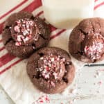 three peppermint fudge cookies on red and white napkin