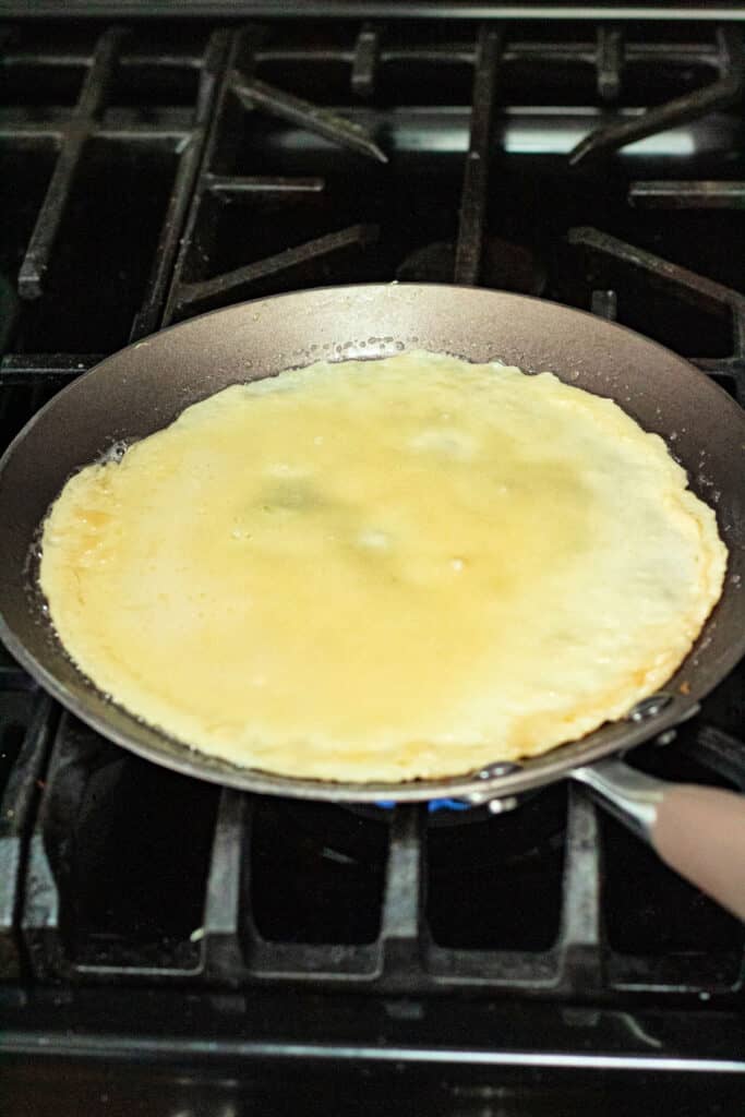 crepe cooking in pan