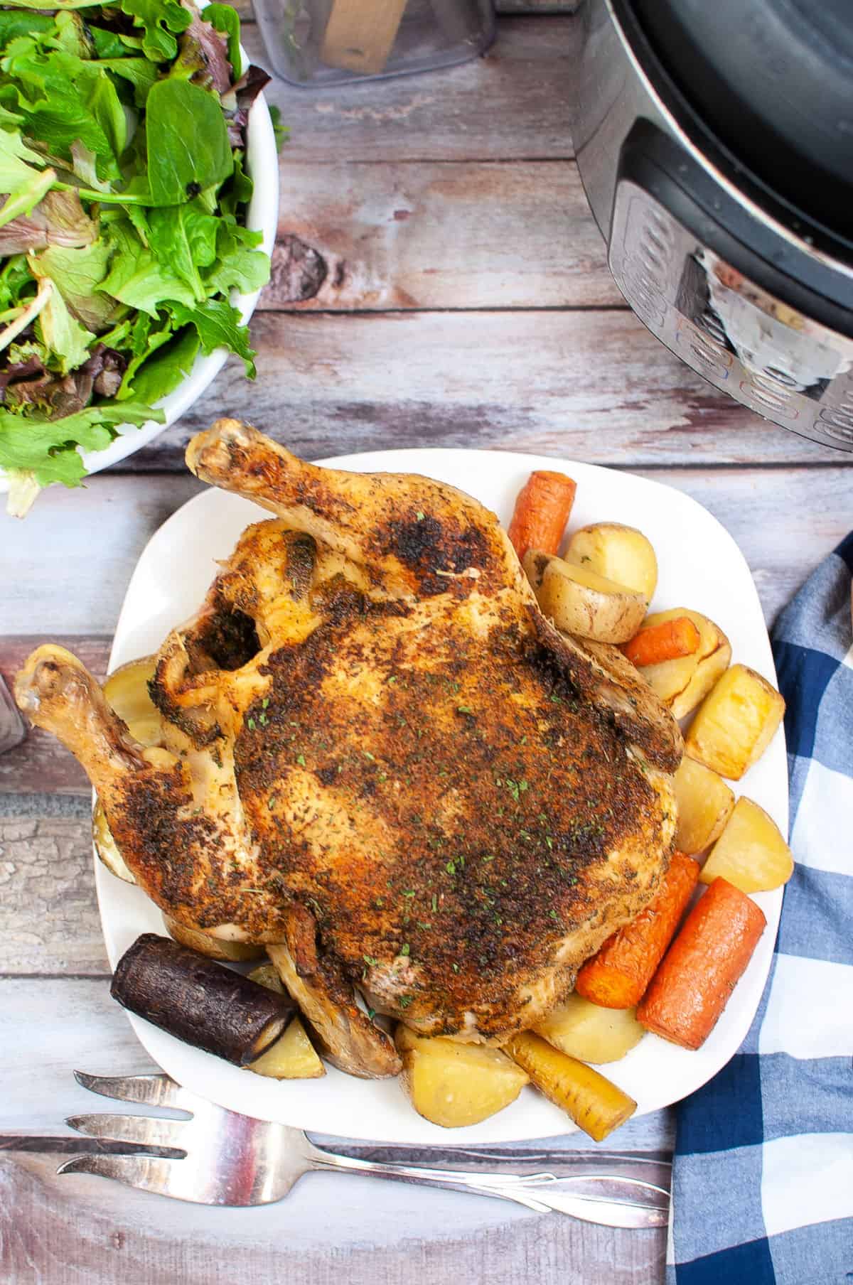 roasted whole chicken on white platter