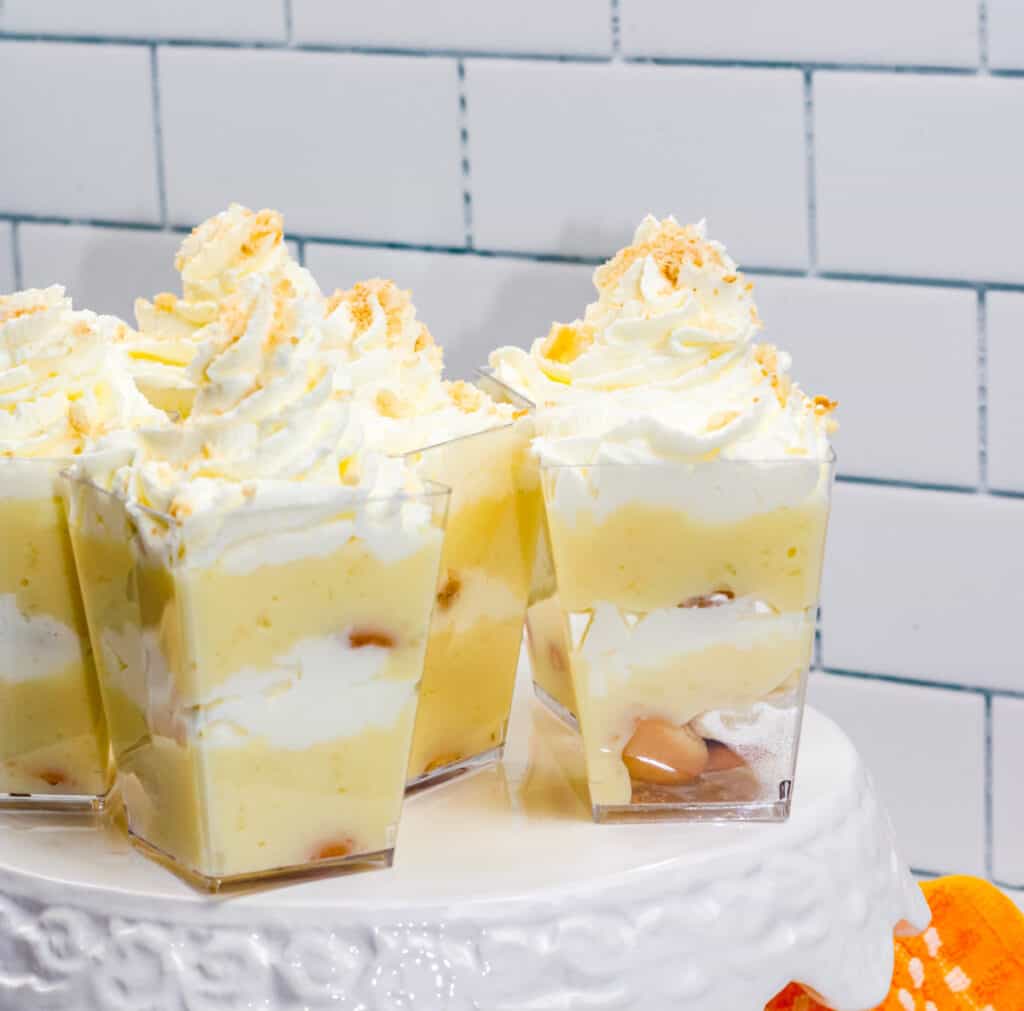 banana pudding cups on white stand