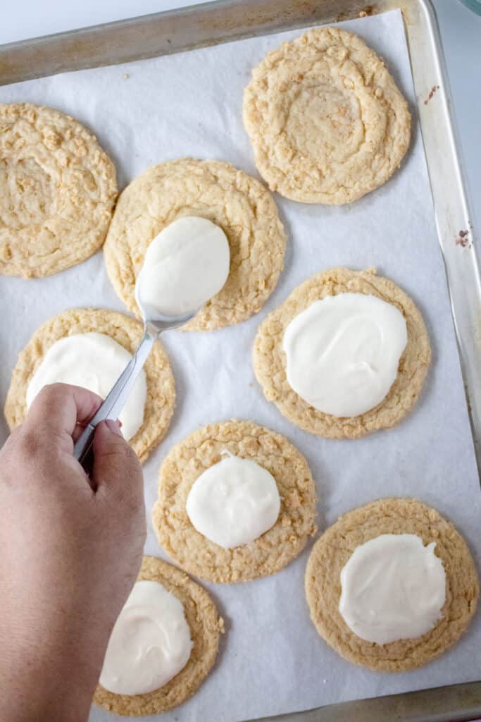 adding filling to crumbl key lime cookies