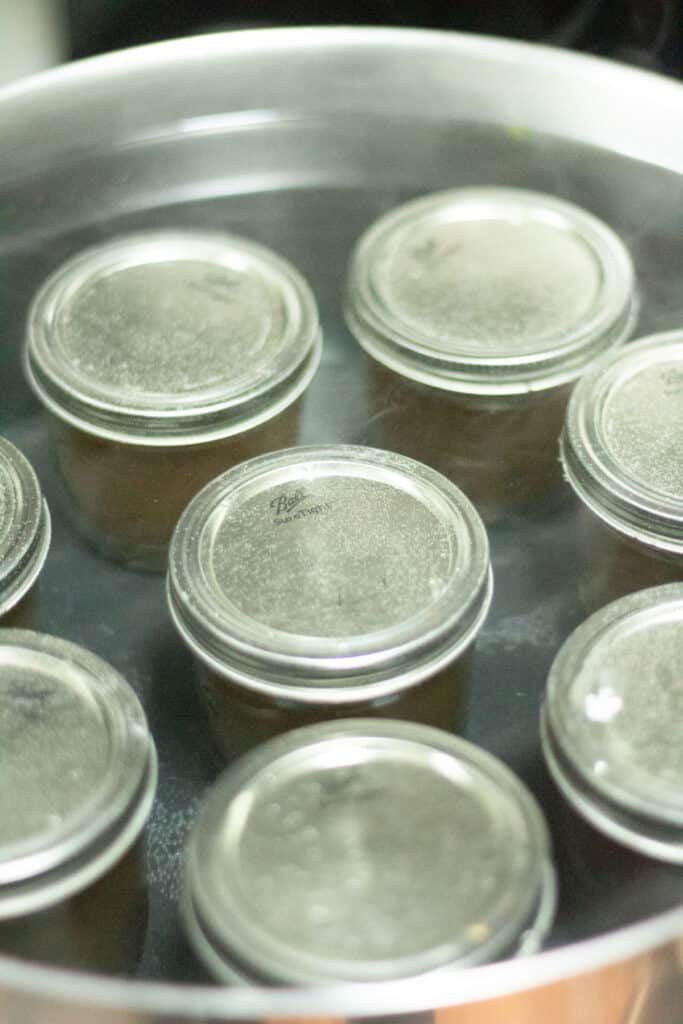 pepper jelly in canning jars during canning process