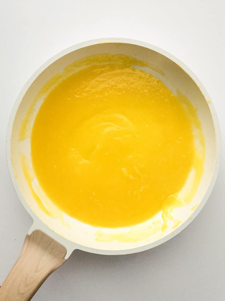 lemon curd cooking in saucepan
