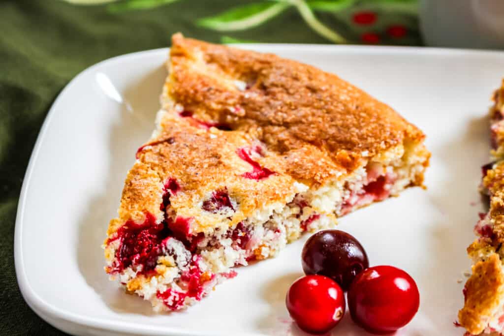 slice of cranberry cake on white plate